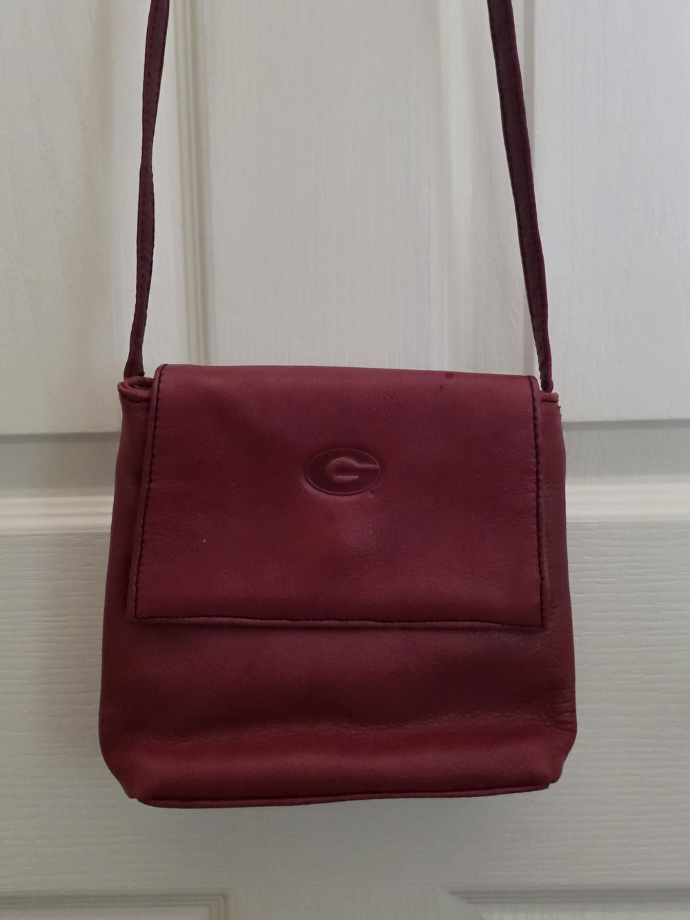 Compact Burgundy Leather Crossbody with Embossed G